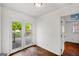 Bright room with French doors leading to a deck and hardwood floors at 1675 Brewer Sw Blvd, Atlanta, GA 30310