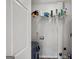 Utility room with a storage shelf and a white door at 1675 Brewer Sw Blvd, Atlanta, GA 30310