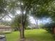 Spacious backyard with mature trees, perfect for outdoor activities and relaxation at 212 Rockmart Rd, Villa Rica, GA 30180
