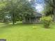 Two-story house featuring a long driveway leading to the cozy front porch at 212 Rockmart Rd, Villa Rica, GA 30180