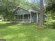 Quaint two-story house with a cozy front porch, perfect for relaxing outdoors at 212 Rockmart Rd, Villa Rica, GA 30180