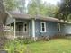 Beautiful two-story home with a welcoming front porch and well-manicured lawn at 212 Rockmart Rd, Villa Rica, GA 30180