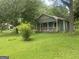 Delightful two-story house with a welcoming porch, nestled in a lush green yard at 212 Rockmart Rd, Villa Rica, GA 30180