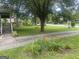 Charming front yard with colorful flowers and a lush green lawn enhance curb appeal at 212 Rockmart Rd, Villa Rica, GA 30180