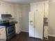 Well-lit kitchen with updated appliances and plenty of cabinet space for storage at 212 Rockmart Rd, Villa Rica, GA 30180