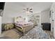 Spacious bedroom featuring an elegant bed, stylish furniture, and a cozy rug at 8717 Lakeview Commons, Jonesboro, GA 30238