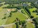 Scenic aerial view capturing a home amid tranquil ponds and expansive greenery at 226 Euharlee Five Forks Rd, Kingston, GA 30145