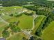 Magnificent aerial shot revealing a home embraced by lush surroundings and peaceful ponds at 226 Euharlee Five Forks Rd, Kingston, GA 30145
