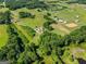 An aerial capture of a home nestled within picturesque greenery, featuring lush trees and open landscapes at 226 Euharlee Five Forks Rd, Kingston, GA 30145