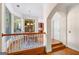 Bright dining area with natural light, hardwood floors, and railing to lower level at 226 Euharlee Five Forks Rd, Kingston, GA 30145