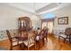 Traditional dining room with hardwood floors and decorative wallpaper at 226 Euharlee Five Forks Rd, Kingston, GA 30145