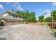 Spacious driveway leading to a three-car garage, basketball hoop, and a charming picket fence at 226 Euharlee Five Forks Rd, Kingston, GA 30145