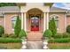 Elegant front entrance with columns and red double doors at 226 Euharlee Five Forks Rd, Kingston, GA 30145
