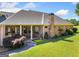 Beautiful brick home featuring manicured lawn, columned porch, and lush landscaping at 226 Euharlee Five Forks Rd, Kingston, GA 30145