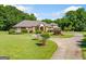 Beautiful brick home with a circular driveway and well-manicured lawn at 226 Euharlee Five Forks Rd, Kingston, GA 30145