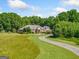 Beautiful single-story home with a circular driveway, lush landscaping, and a welcoming entrance at 226 Euharlee Five Forks Rd, Kingston, GA 30145