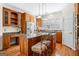 Kitchen with wooden cabinets, stainless steel appliances, granite countertops, hardwood floors, and center island at 226 Euharlee Five Forks Rd, Kingston, GA 30145