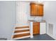 Basement kitchenette with wood cabinets, countertop space and a white mini-refrigerator at 226 Euharlee Five Forks Rd, Kingston, GA 30145
