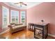 Bay window area with chaise lounge and hardwood floors in the main bedroom with fireplace at 226 Euharlee Five Forks Rd, Kingston, GA 30145