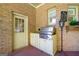 Outdoor kitchen setup with stainless steel grill, sink, and door to indoor space at 226 Euharlee Five Forks Rd, Kingston, GA 30145