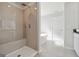 An elegant bathroom featuring a large shower with a built-in bench at 257 Orwell Drive Lot 48 # 48, Social Circle, GA 30025