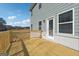 New home features a wooden deck and a door that leads into the interior of the house at 257 Orwell Drive Lot 48 # 48, Social Circle, GA 30025