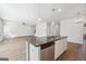 Kitchen island featuring granite countertops and stainless steel appliances at 257 Orwell Drive Lot 48 # 48, Social Circle, GA 30025