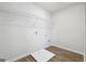 Laundry room includes wood-look flooring, wire shelving, and washer and dryer hookups at 257 Orwell Drive Lot 48 # 48, Social Circle, GA 30025