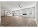 Open-concept living area with fireplace, hardwood floors, and modern kitchen at 257 Orwell Drive Lot 48 # 48, Social Circle, GA 30025