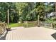 Expansive back deck overlooking a lush, green lawn and wooded area, perfect for outdoor entertaining and relaxation at 136 Barrington Grange Dr, Sharpsburg, GA 30277