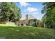 Expansive backyard with a wooden fence, a large deck, and plenty of space for outdoor activities at 136 Barrington Grange Dr, Sharpsburg, GA 30277
