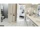 Bathroom featuring white tile floors and a spacious vanity with double sinks and ample storage space at 136 Barrington Grange Dr, Sharpsburg, GA 30277