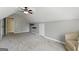 Spacious bonus room with neutral walls, plush carpeting, ceiling fan, and unique architectural ceiling at 136 Barrington Grange Dr, Sharpsburg, GA 30277