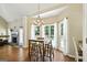 Inviting breakfast nook with hardwood floors, chandelier, and bay windows, ideal for casual dining and relaxation at 136 Barrington Grange Dr, Sharpsburg, GA 30277