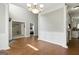 Elegant dining room with hardwood floors, wainscoting, and a stylish chandelier, great for hosting gatherings at 136 Barrington Grange Dr, Sharpsburg, GA 30277