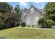 Beautiful home with a well-manicured lawn and manicured landscaping around the foundation at 136 Barrington Grange Dr, Sharpsburg, GA 30277