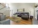Spacious living room features a beautiful stone fireplace and hardwood floors creating a warm and inviting atmosphere at 136 Barrington Grange Dr, Sharpsburg, GA 30277