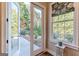 Bright back door and window featuring backyard views and tasteful window treatments at 214 Palette Ln, Peachtree City, GA 30269