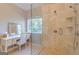 This elegant primary bathroom features a makeup vanity and a walk-in shower with a glass enclosure at 214 Palette Ln, Peachtree City, GA 30269