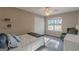 The secondary bedroom offers a ceiling fan, a large window with natural light and soft, clean carpet at 214 Palette Ln, Peachtree City, GA 30269