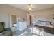 Bright bedroom features neutral paint, white ceiling fan, and en-suite door for easy access at 214 Palette Ln, Peachtree City, GA 30269