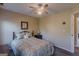 Comfortable bedroom featuring an iron bed frame and a ceiling fan for enhanced air flow at 214 Palette Ln, Peachtree City, GA 30269