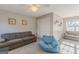 Bonus room with sofa, beanbag, carpet, a ceiling fan, and natural light at 214 Palette Ln, Peachtree City, GA 30269