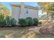 Home exterior featuring tidy landscaping and a well-maintained lawn at 214 Palette Ln, Peachtree City, GA 30269