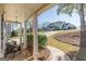 Covered front porch with comfortable seating, exterior lighting, and neighborhood views at 214 Palette Ln, Peachtree City, GA 30269