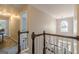 Upper hallway with chandelier lighting and views of the entry, enhancing the home's appeal at 214 Palette Ln, Peachtree City, GA 30269