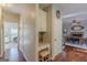 Hallway features a built-in desk and chair, hardwood floors, and access to the dining room at 214 Palette Ln, Peachtree City, GA 30269