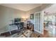 Spacious home office with French doors, hardwood floors, and a view of the dining area at 214 Palette Ln, Peachtree City, GA 30269