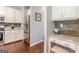 Modern kitchen area with stainless steel appliances, granite countertops, and a cozy desk nook at 214 Palette Ln, Peachtree City, GA 30269