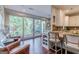 Inviting kitchen area with granite countertops, a breakfast bar, and sliding glass doors to the backyard at 214 Palette Ln, Peachtree City, GA 30269
